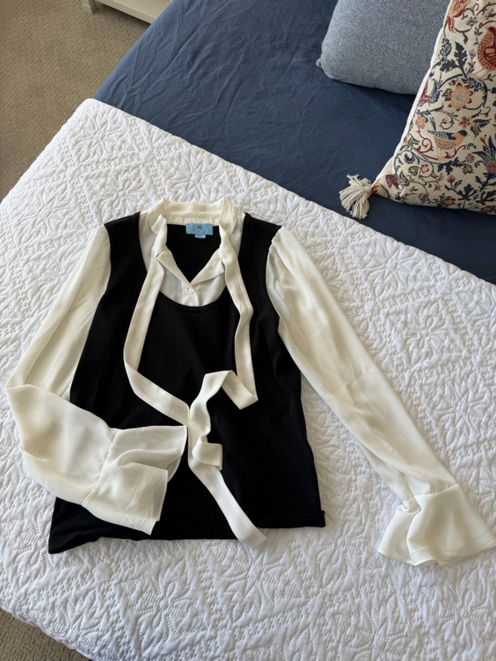 CeCe Black Knit Vest with Ivory Tie-Neck Blouse